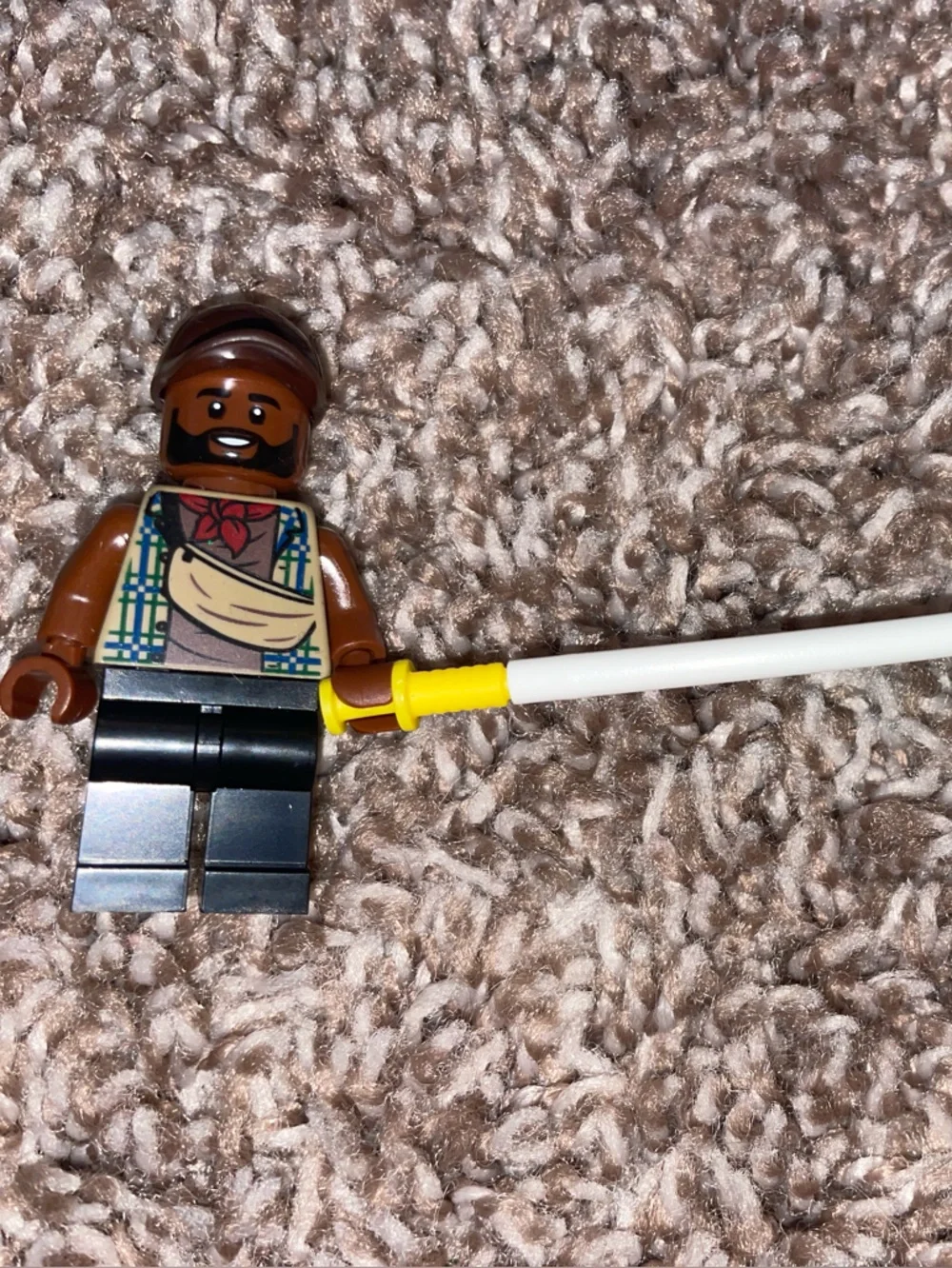 Lego Brown Minifigure with Black Legs and Yellow-Handled White Staff